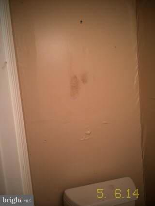 2242 Southgate Square Reston, VA 20191 - Photo 14 of 26 Half bath by front door (old water dmg not fixed)
