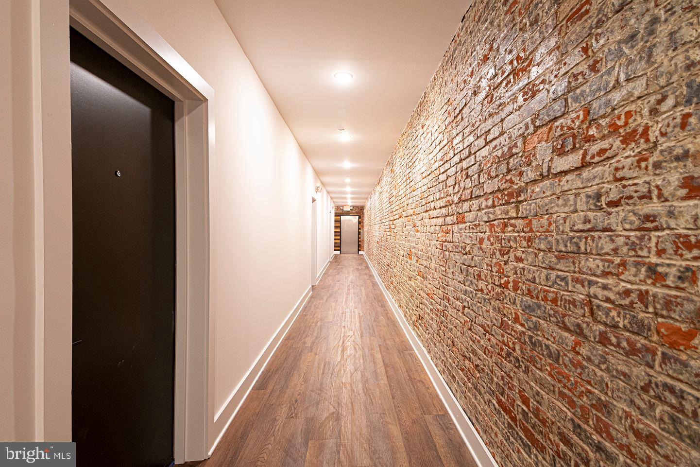 1211 Bainbridge Street, Unit 4C Philadelphia, PA 19147 - Photo 15 of 19 a view of entryway with wooden floor