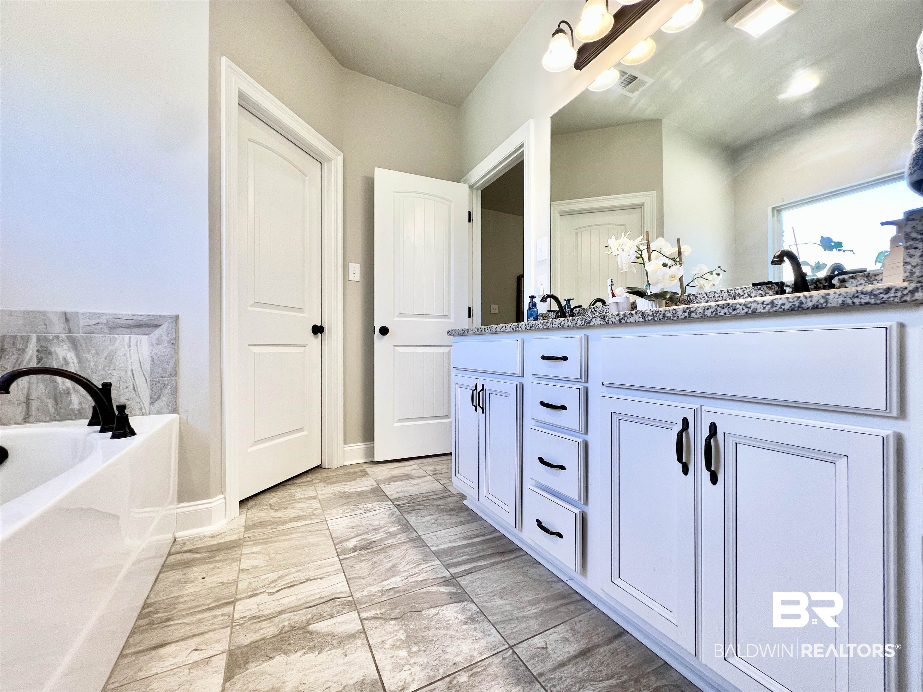 32290 Calder Court Daphne, AL 36527 - Photo 45 of 59 Bathroom with vanity and a bath