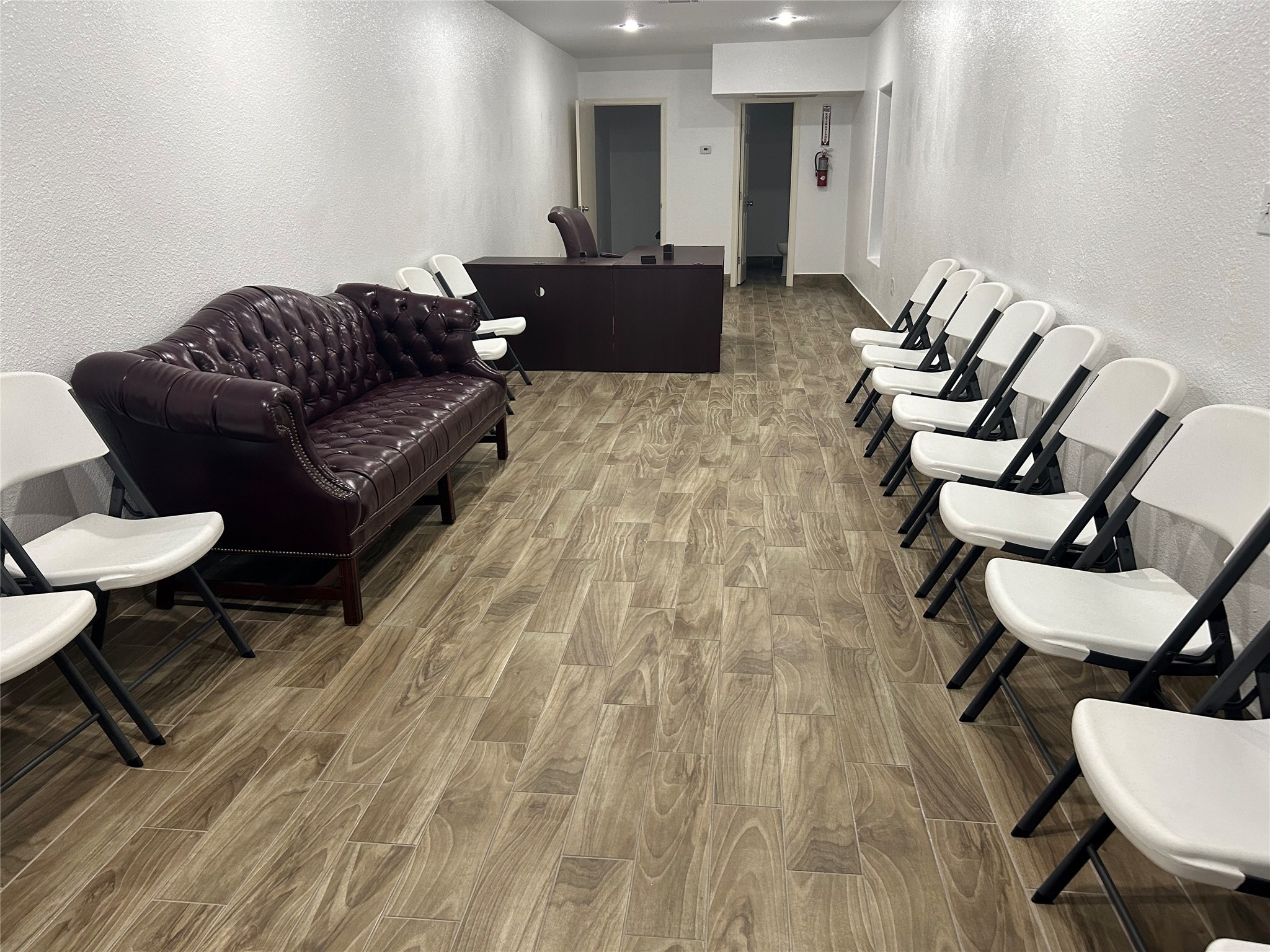 7424 Lindencrest Street Houston, TX 77061 - Photo 2 of 6 a living room with furniture and a wooden floor