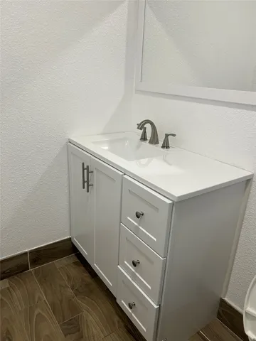 a bathroom with a sink and vanity