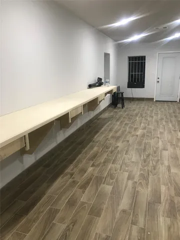 a spacious bathroom with a sink and a mirror