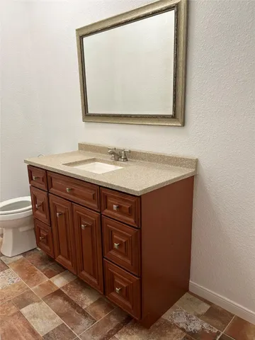 a bathroom with a sink and mirror