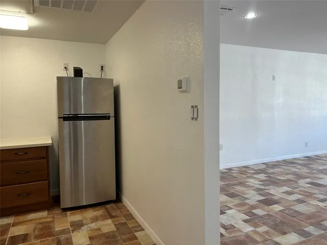 a view of door with wooden floor