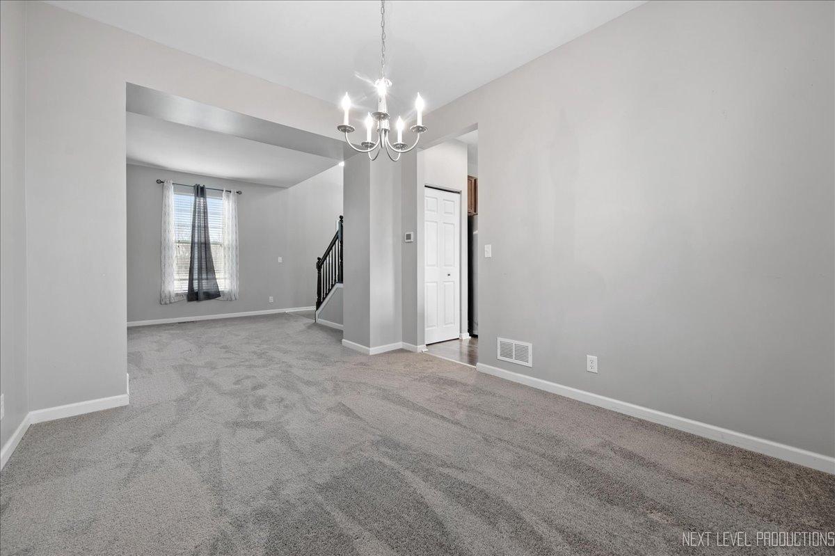 442 Windett Ridge Road Yorkville, IL 60560 - Photo 14 of 43 a view of a chandelier in big room and chandelier