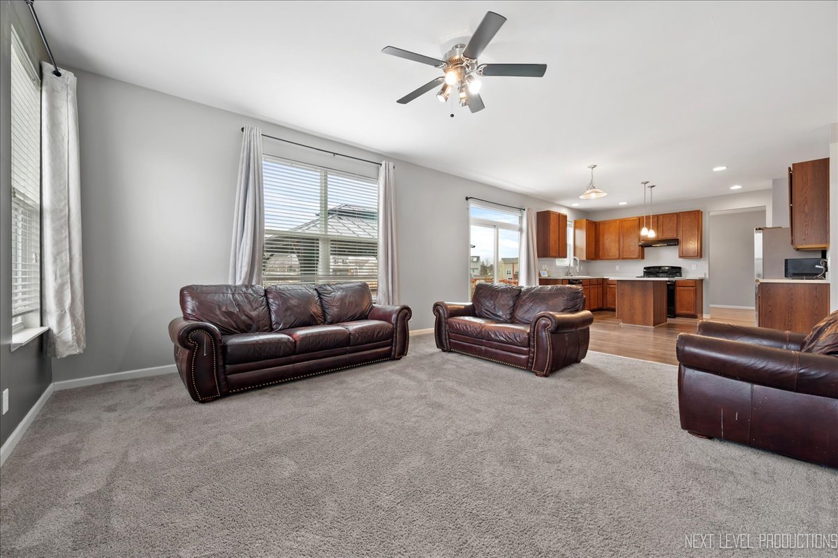 442 Windett Ridge Road Yorkville, IL 60560 - Photo 19 of 43 a living room with furniture and a large window