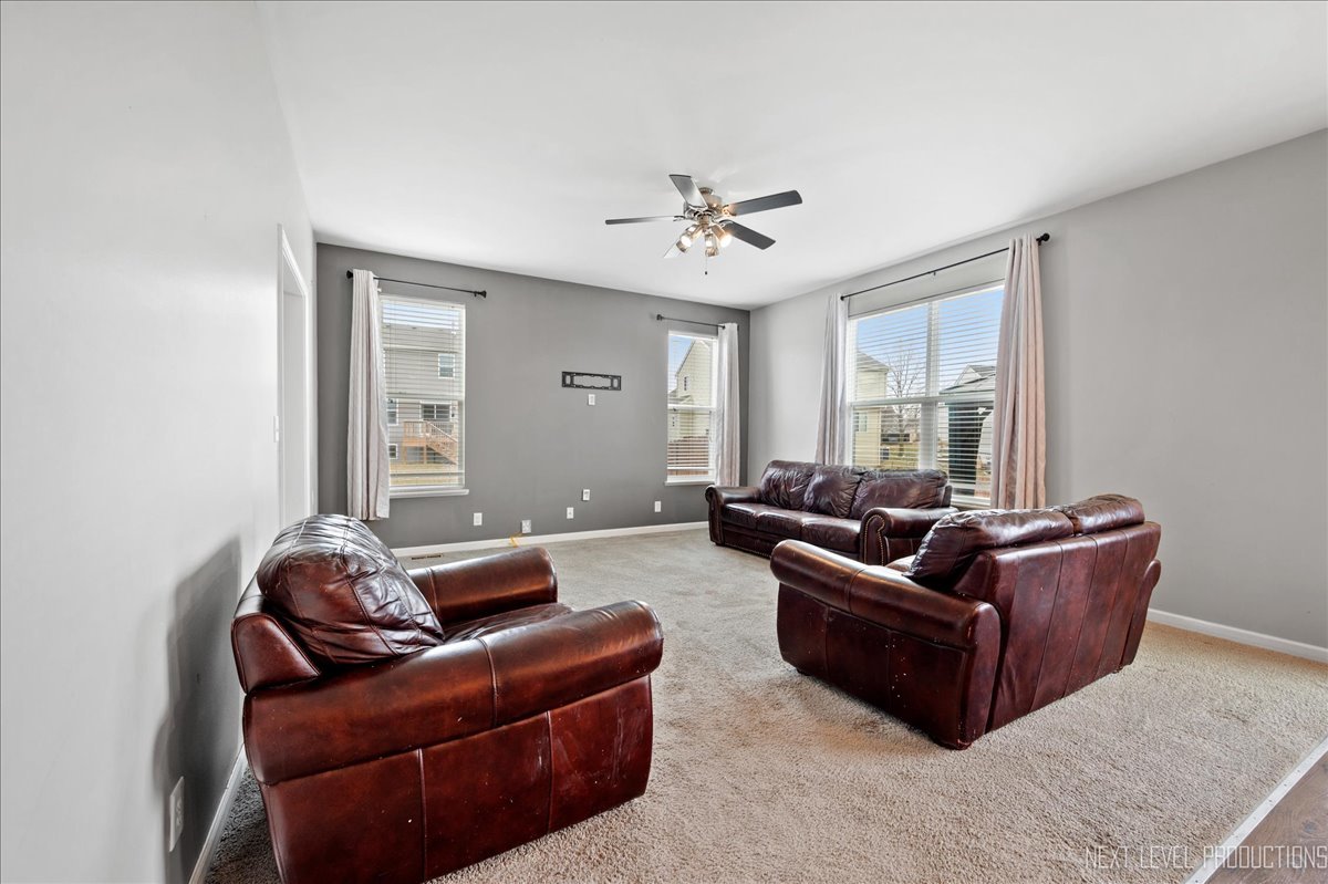 442 Windett Ridge Road Yorkville, IL 60560 - Photo 20 of 43 a living room with furniture and a window