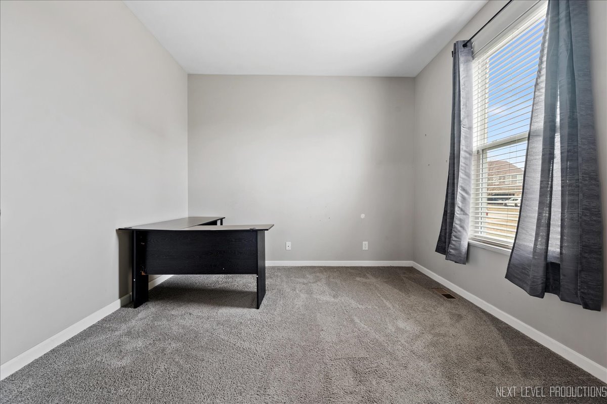 442 Windett Ridge Road Yorkville, IL 60560 - Photo 21 of 43 a room with window and a table