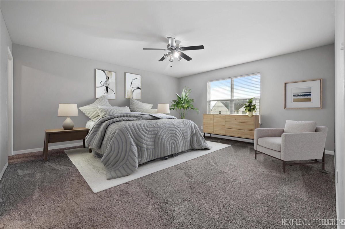 442 Windett Ridge Road Yorkville, IL 60560 - Photo 23 of 43 a bedroom with bed and window