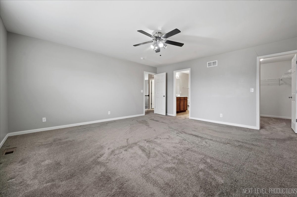 442 Windett Ridge Road Yorkville, IL 60560 - Photo 25 of 43 a view of a livingroom with a ceiling fan and window