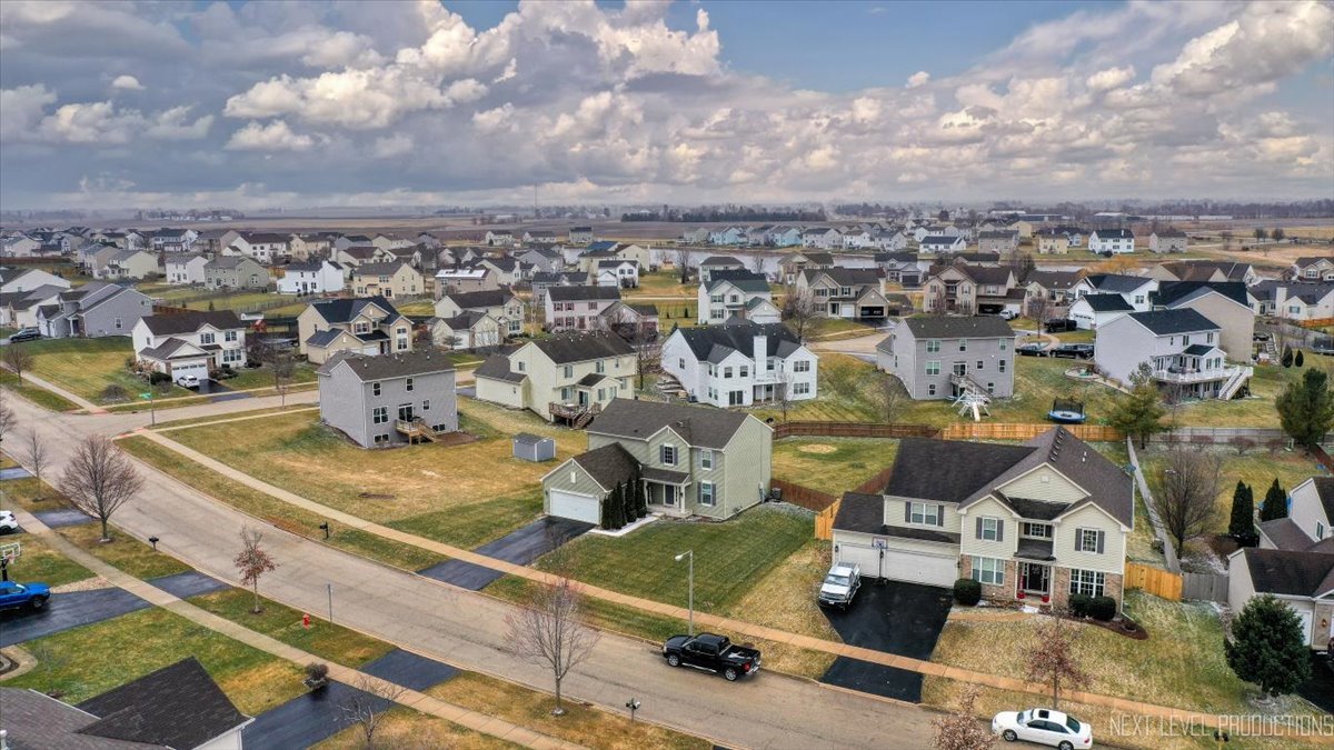 442 Windett Ridge Road Yorkville, IL 60560 - Photo 3 of 43 an aerial view of a city with lots of residential buildings