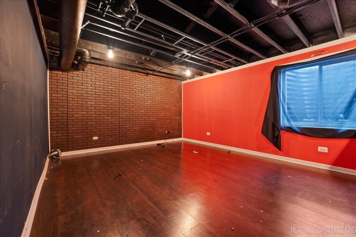 442 Windett Ridge Road Yorkville, IL 60560 - Photo 32 of 43 a view of an empty room with wooden floor