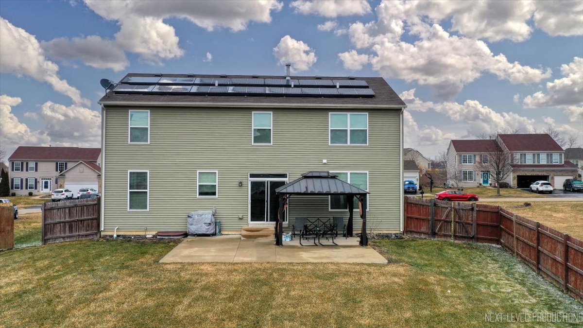 442 Windett Ridge Road Yorkville, IL 60560 - Photo 37 of 43 a view of a house with a patio and fire pit