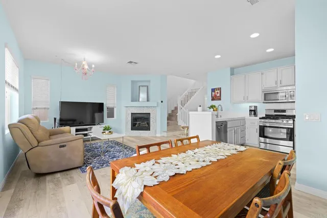 a living room with furniture fireplace and flat screen tv