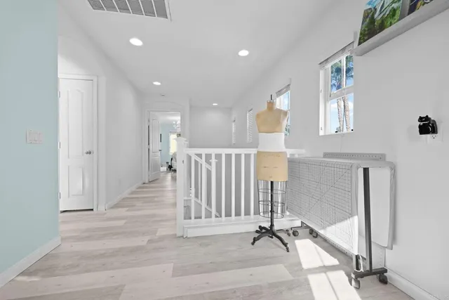 a view of a hallway with windows