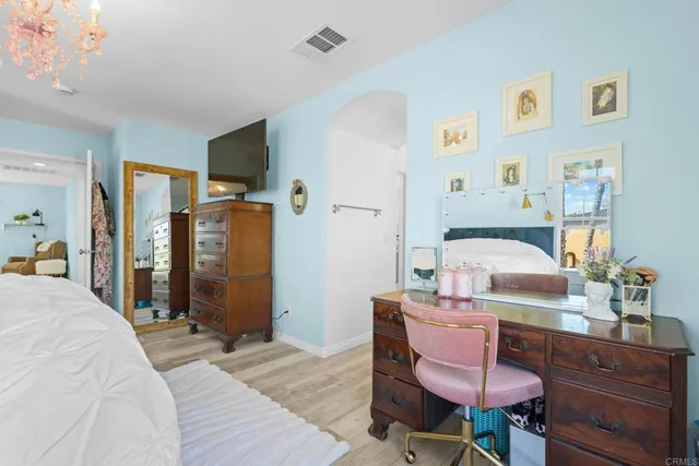 a bedroom with a bed and furniture