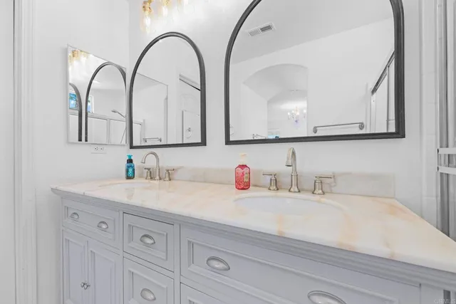 a bathroom with sink and mirror