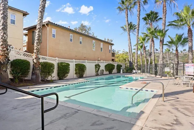 a view of a patio with a table and chairs