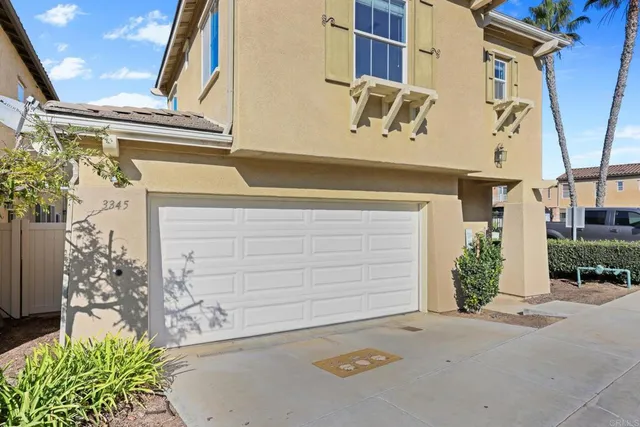a front view of a house with a garage