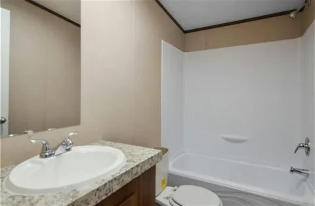 348 Ruby Ridge Drive Talking Rock, GA 30175 - Photo 17 of 17 a bathroom with a granite countertop sink toilet and shower