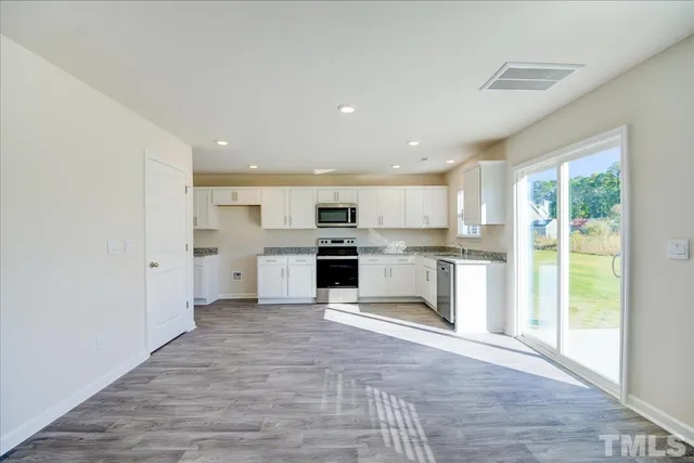 wooden floor in an empty room with a gallery