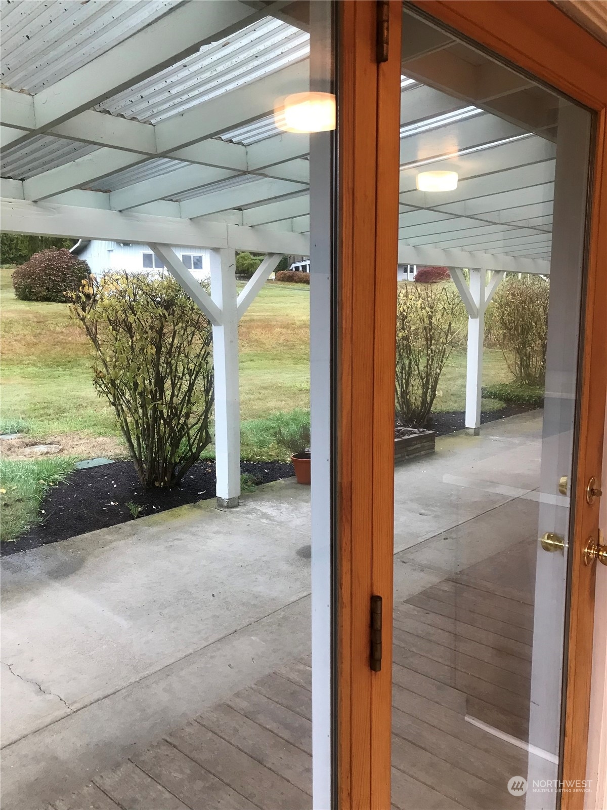 22817 Jefferson Point Road Northeast Kingston, WA 98346 - Photo 13 of 24 a view of a glass door with a yard