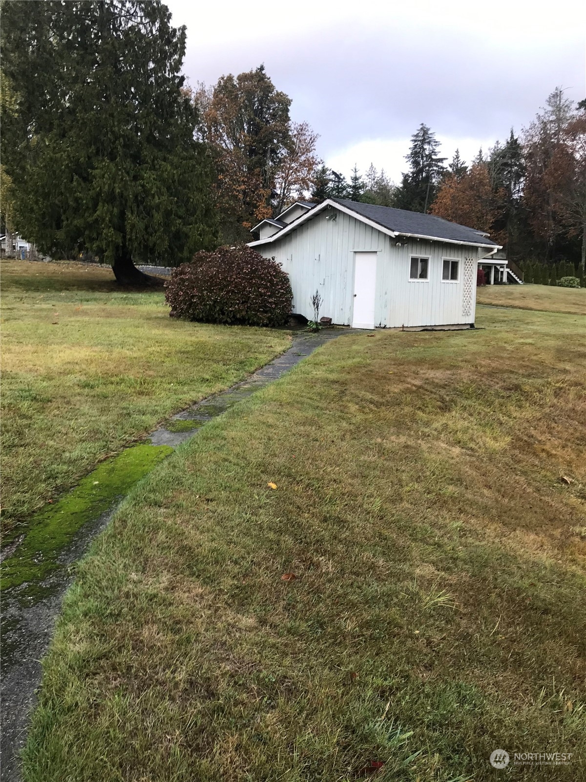 22817 Jefferson Point Road Northeast Kingston, WA 98346 - Photo 15 of 24 a view of a house with a yard