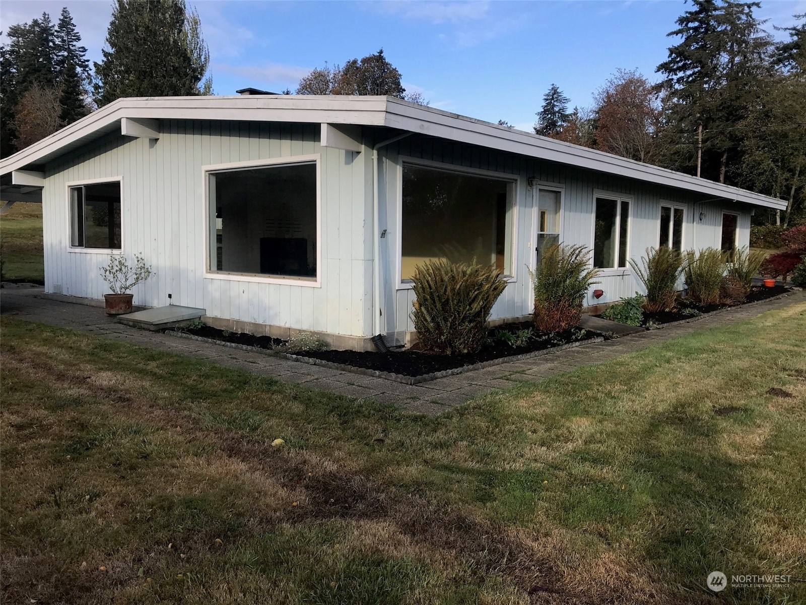 22817 Jefferson Point Road Northeast Kingston, WA 98346 - Photo 18 of 24 a view of a house with backyard