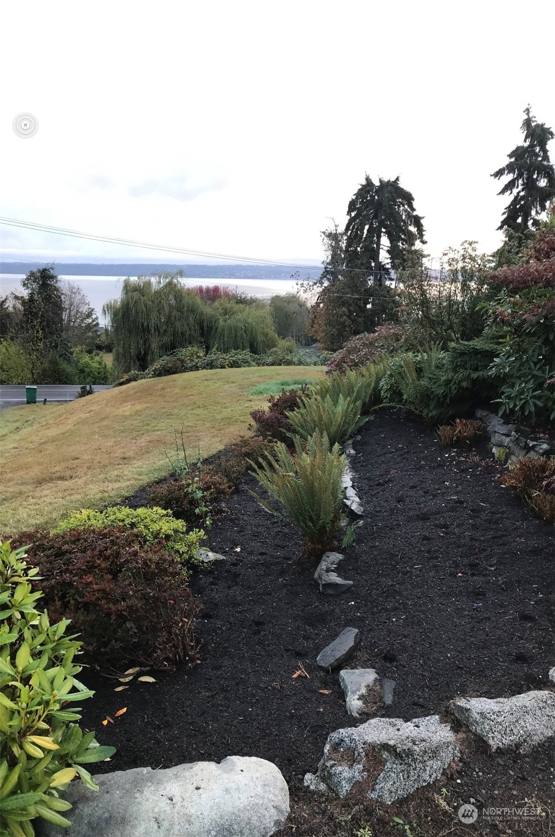 22817 Jefferson Point Road Northeast Kingston, WA 98346 - Photo 20 of 24 a view of an outdoor space with green field and trees