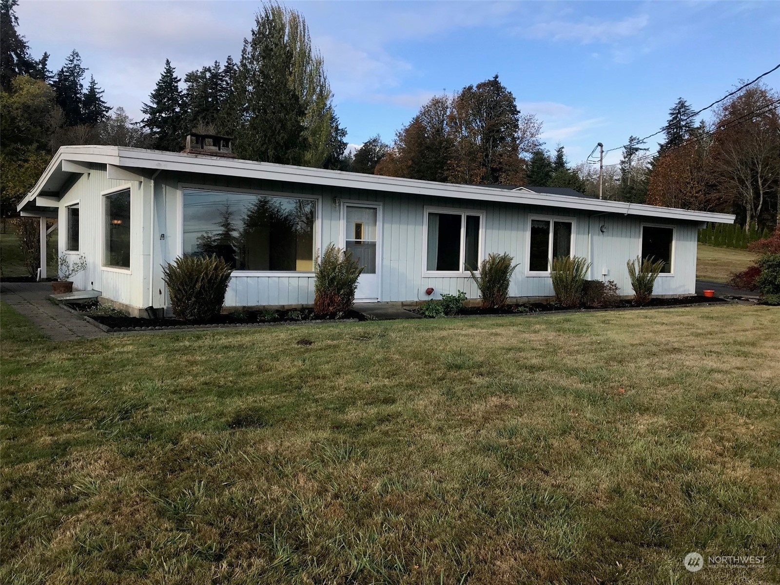 22817 Jefferson Point Road Northeast Kingston, WA 98346 - Photo 2 of 24 a view of a house with a yard