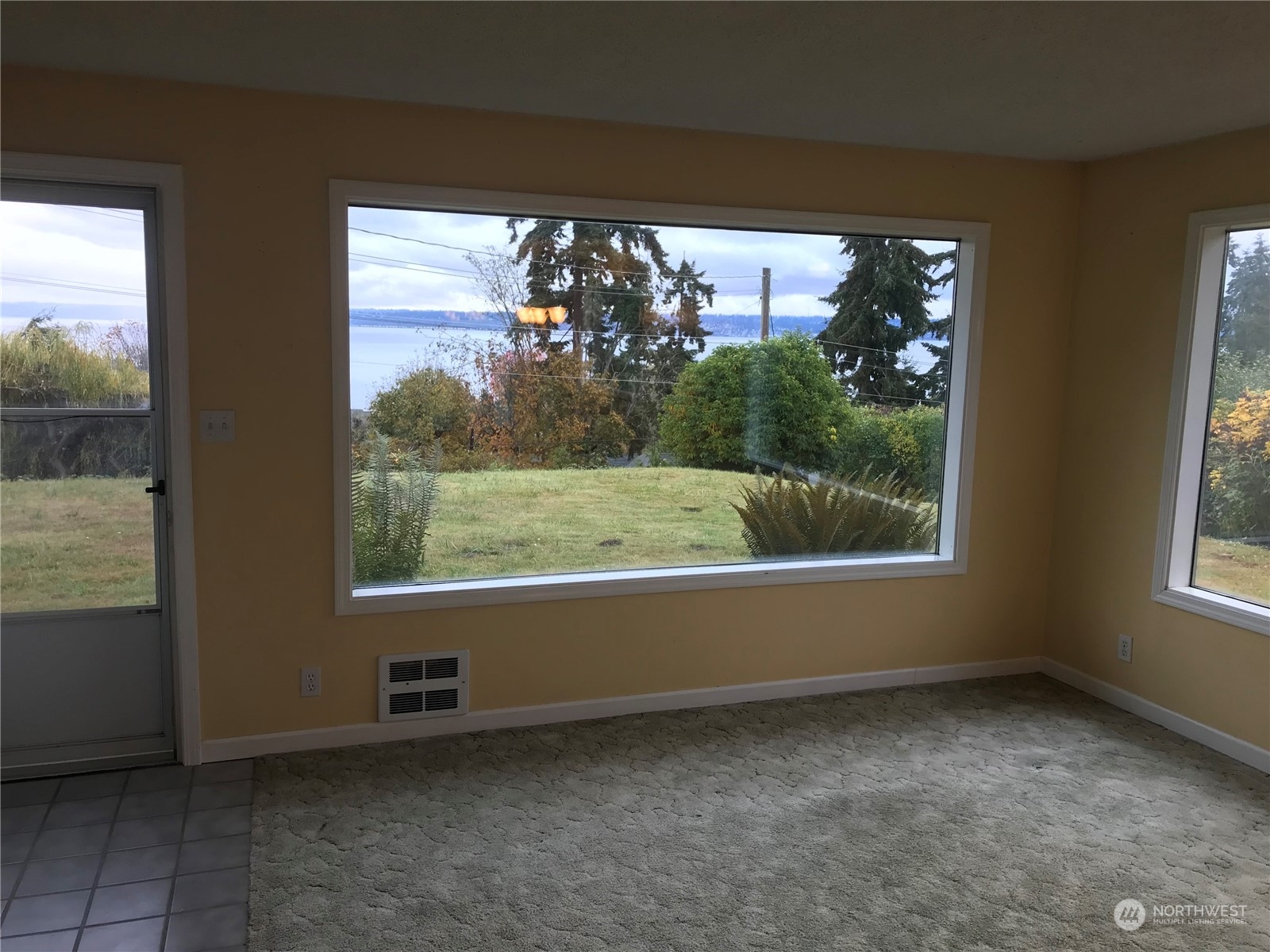 22817 Jefferson Point Road Northeast Kingston, WA 98346 - Photo 5 of 24 a view of an empty room with a window