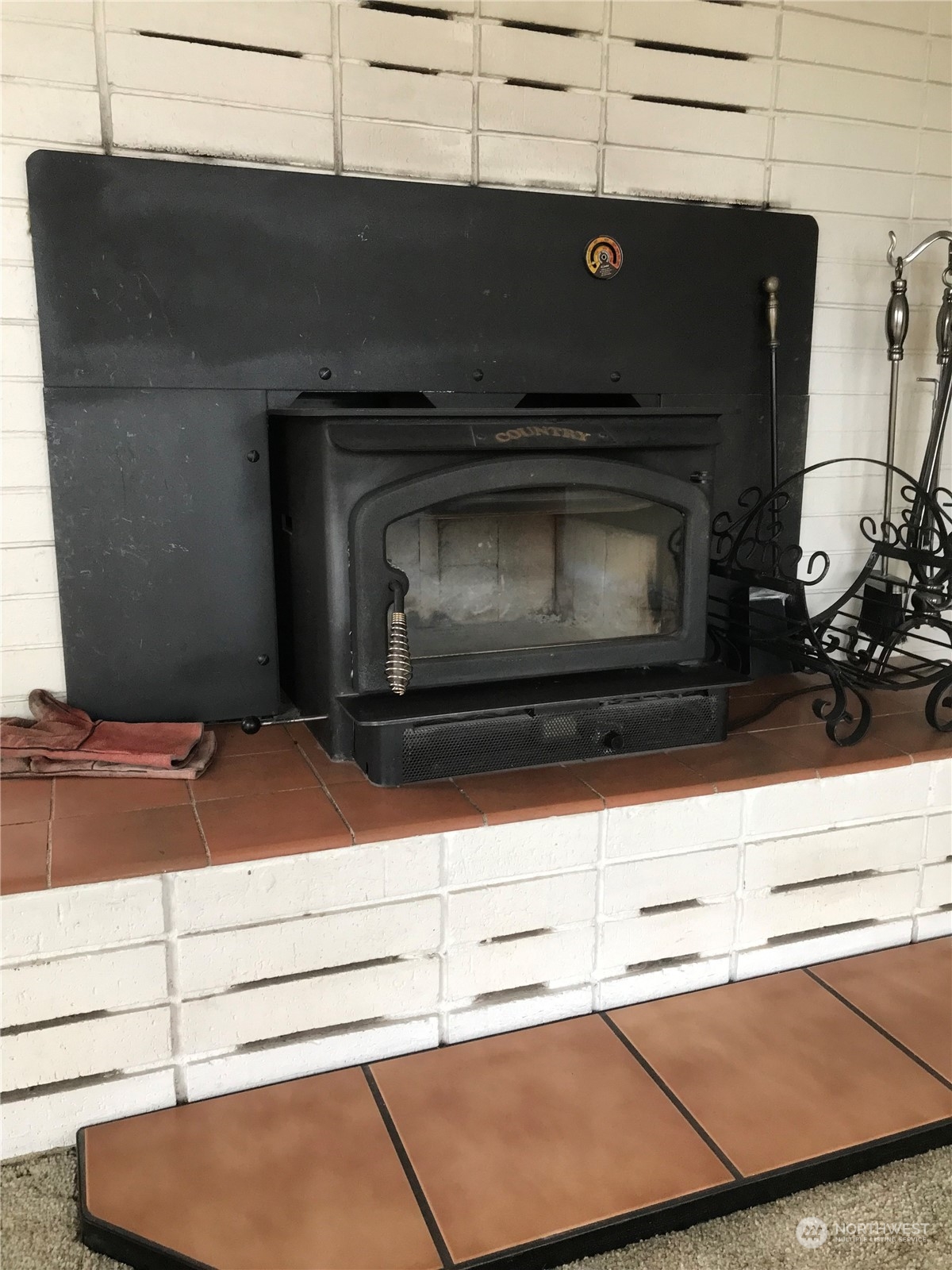 22817 Jefferson Point Road Northeast Kingston, WA 98346 - Photo 7 of 24 a stove top oven sitting inside of a kitchen