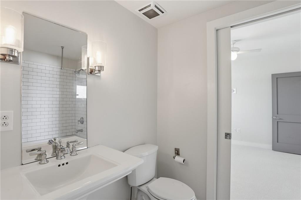 1100 Howell Mill Road Northwest, Unit 608 Atlanta, GA 30318 - Photo 23 of 37 a bathroom with a sink toilet and shower