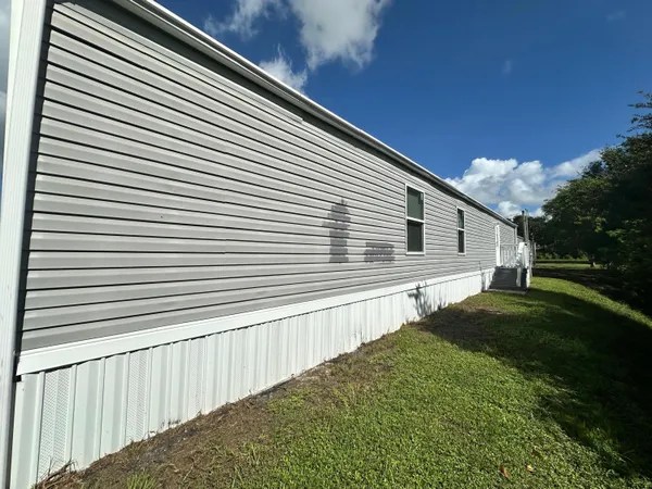 a view of a back yard of the house
