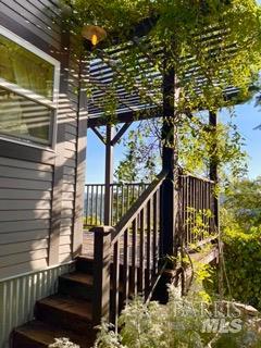 18574 Tomki Road Willits, CA 95490 - Photo 15 of 25 a view of balcony with wooden floor and outdoor seating
