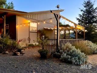 18574 Tomki Road Willits, CA 95490 - Photo 16 of 25 a view of a chair and tables in the patio