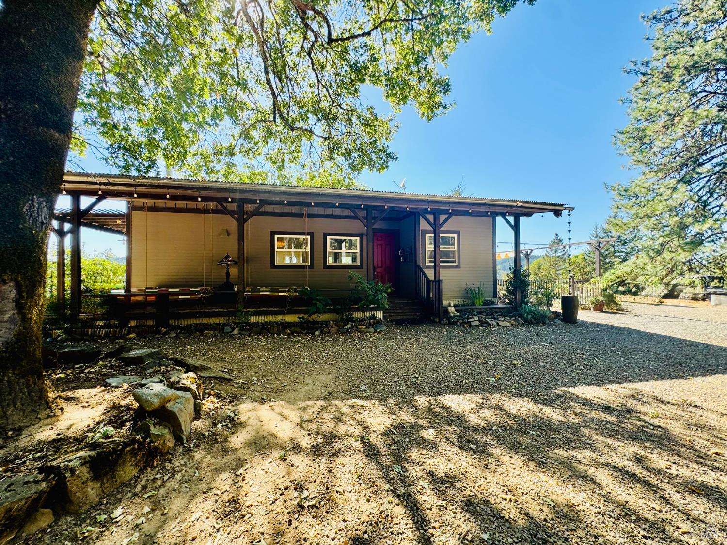 18574 Tomki Road Willits, CA 95490 - Photo 18 of 25 a view of house with backyard and garden