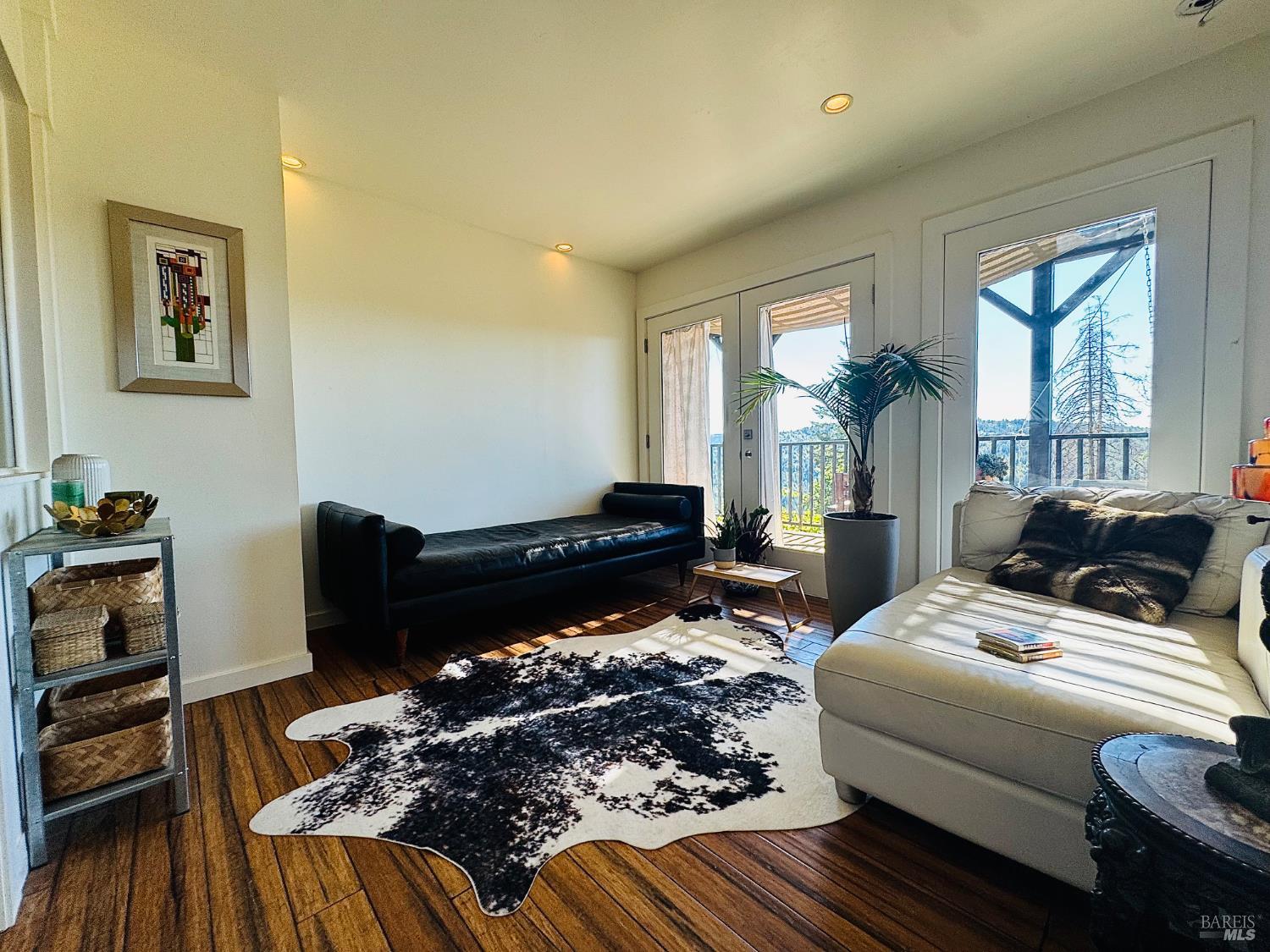 18574 Tomki Road Willits, CA 95490 - Photo 7 of 25 a living room with furniture fireplace and wooden floor
