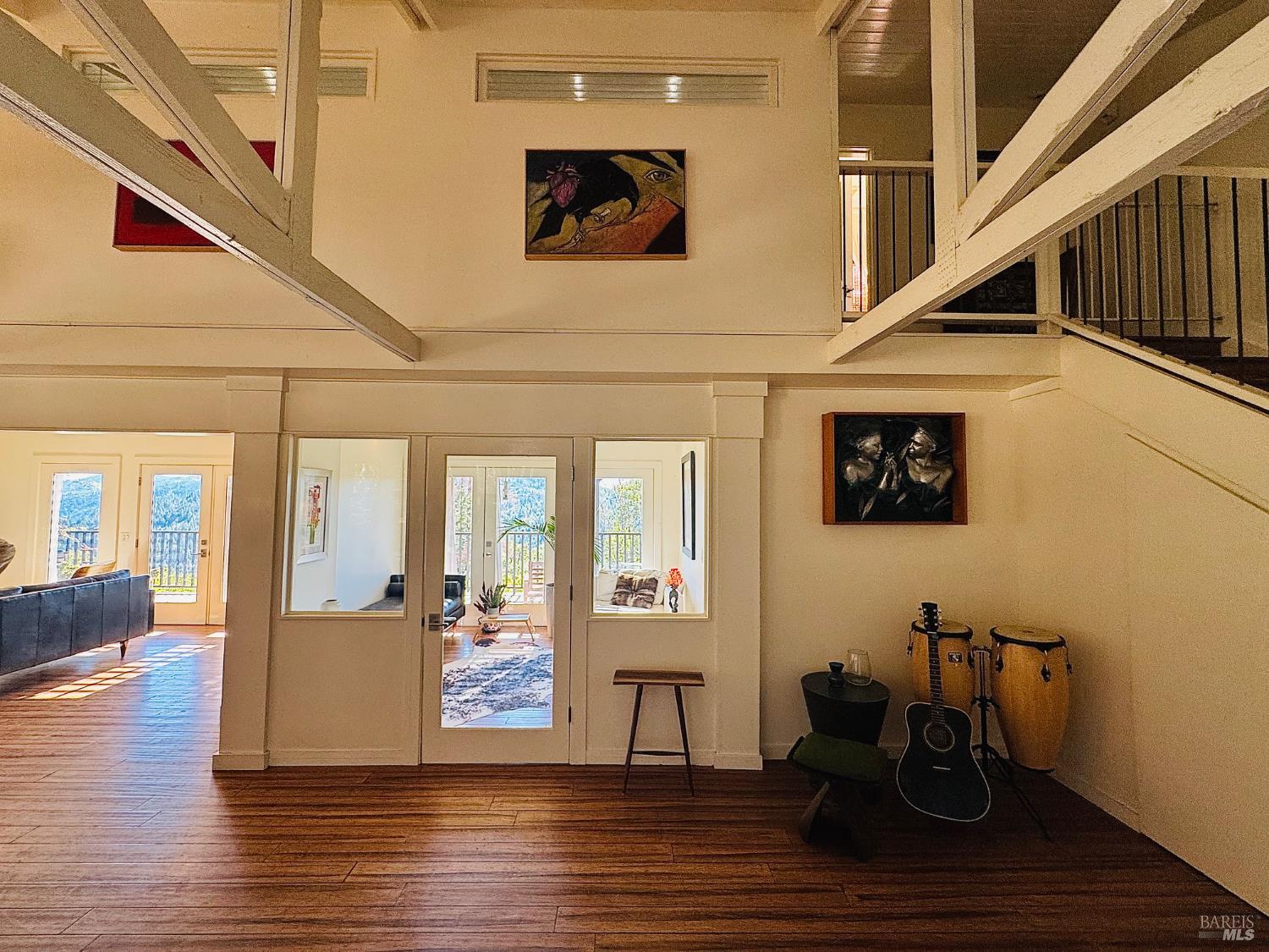 18574 Tomki Road Willits, CA 95490 - Photo 8 of 25 a view of a hallway with wooden floor and dining room view