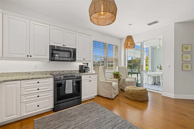 a kitchen with a stove a sink and a refrigerator