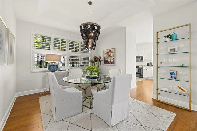 a view of a dining room with furniture and a window