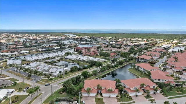 an aerial view of a city with ocean view
