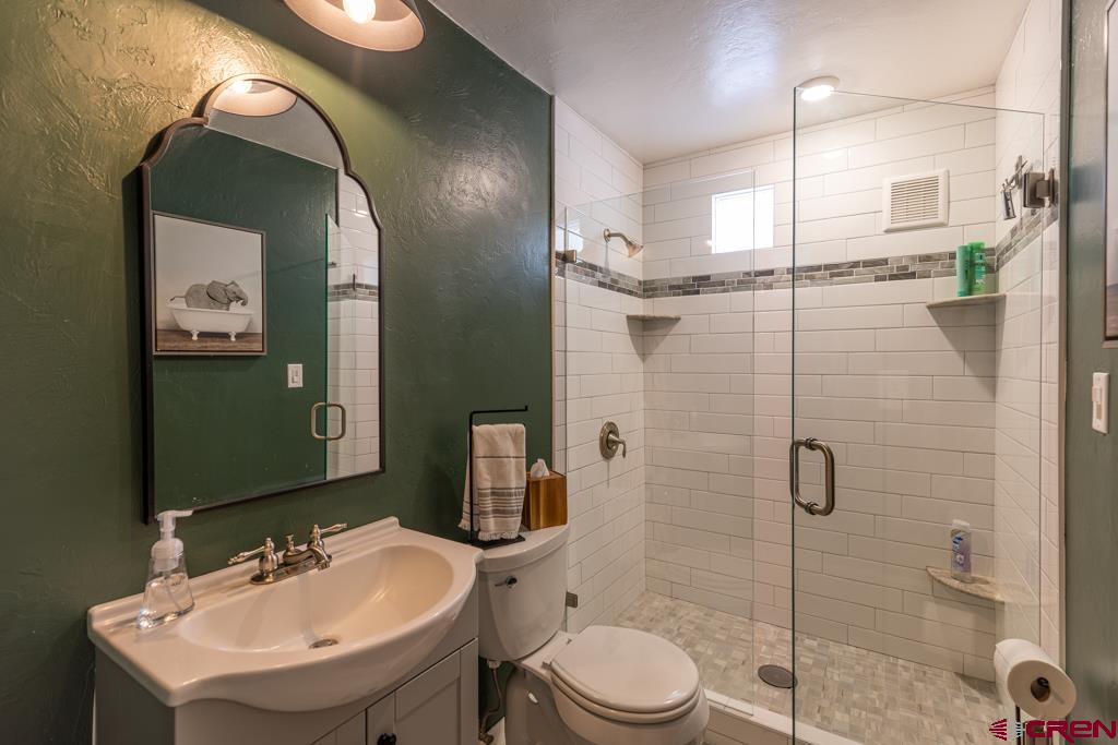 150 Mountain Top Road Durango, CO 81303 - Photo 23 of 31 a bathroom with a sink toilet and shower
