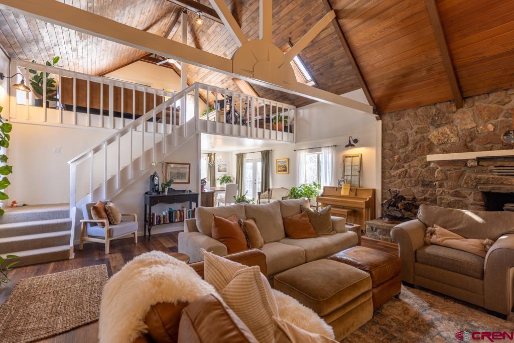 150 Mountain Top Road Durango, CO 81303 - Photo 8 of 31 a living room with furniture a ceiling fan and a rug