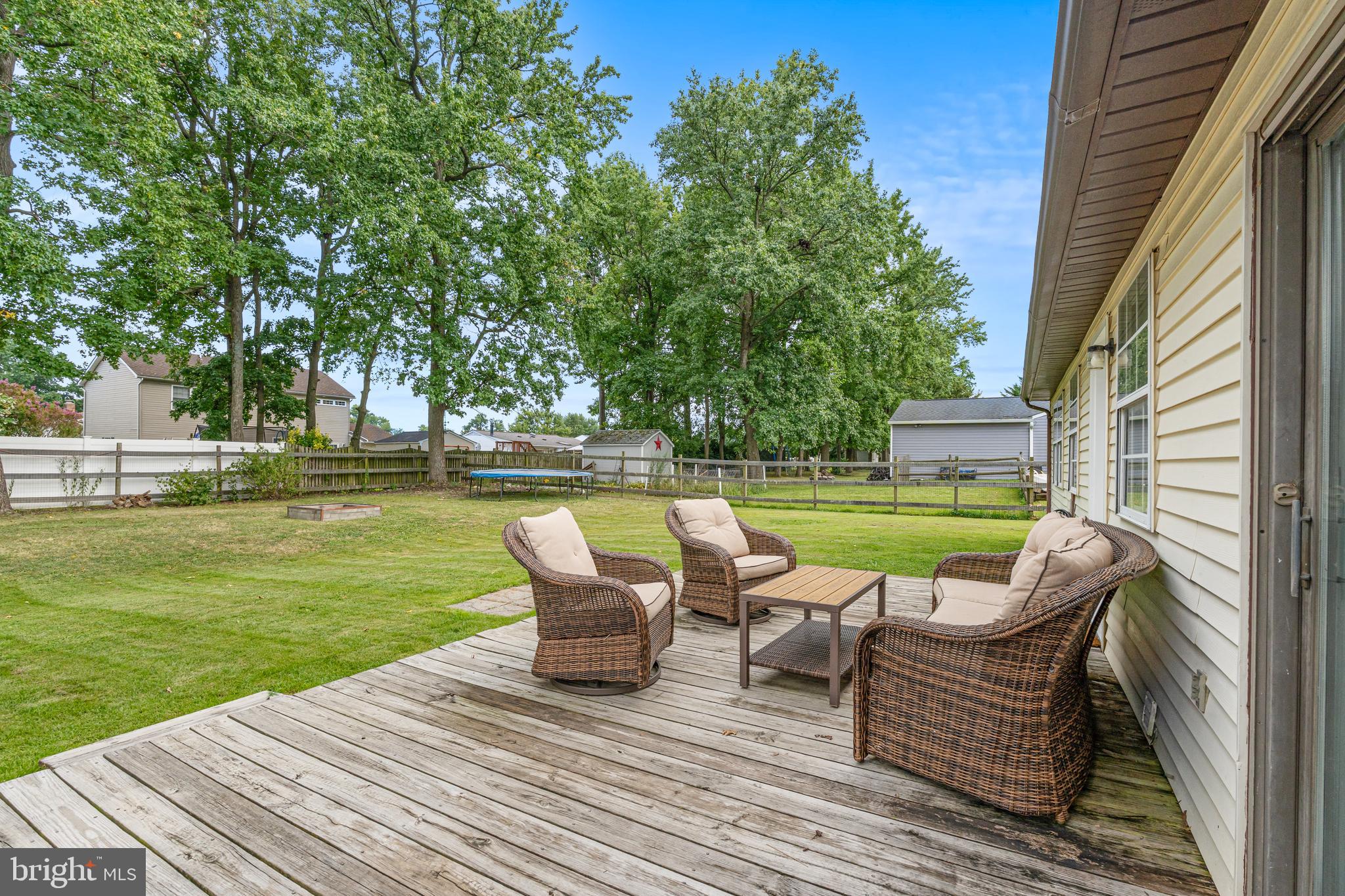 2423 Lodge Farm Road Sparrows Point, MD 21219 - Photo 4 of 29 a view of a patio with lawn chairs next to a yard