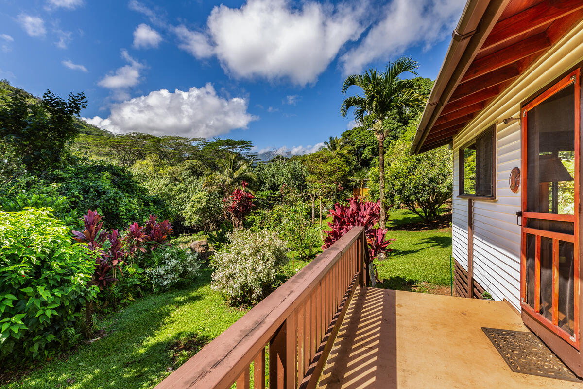 4867 Wainiha Powerhouse Road Hanalei, HI 96714 - Photo 11 of 26 a view of a house with a yard and garden
