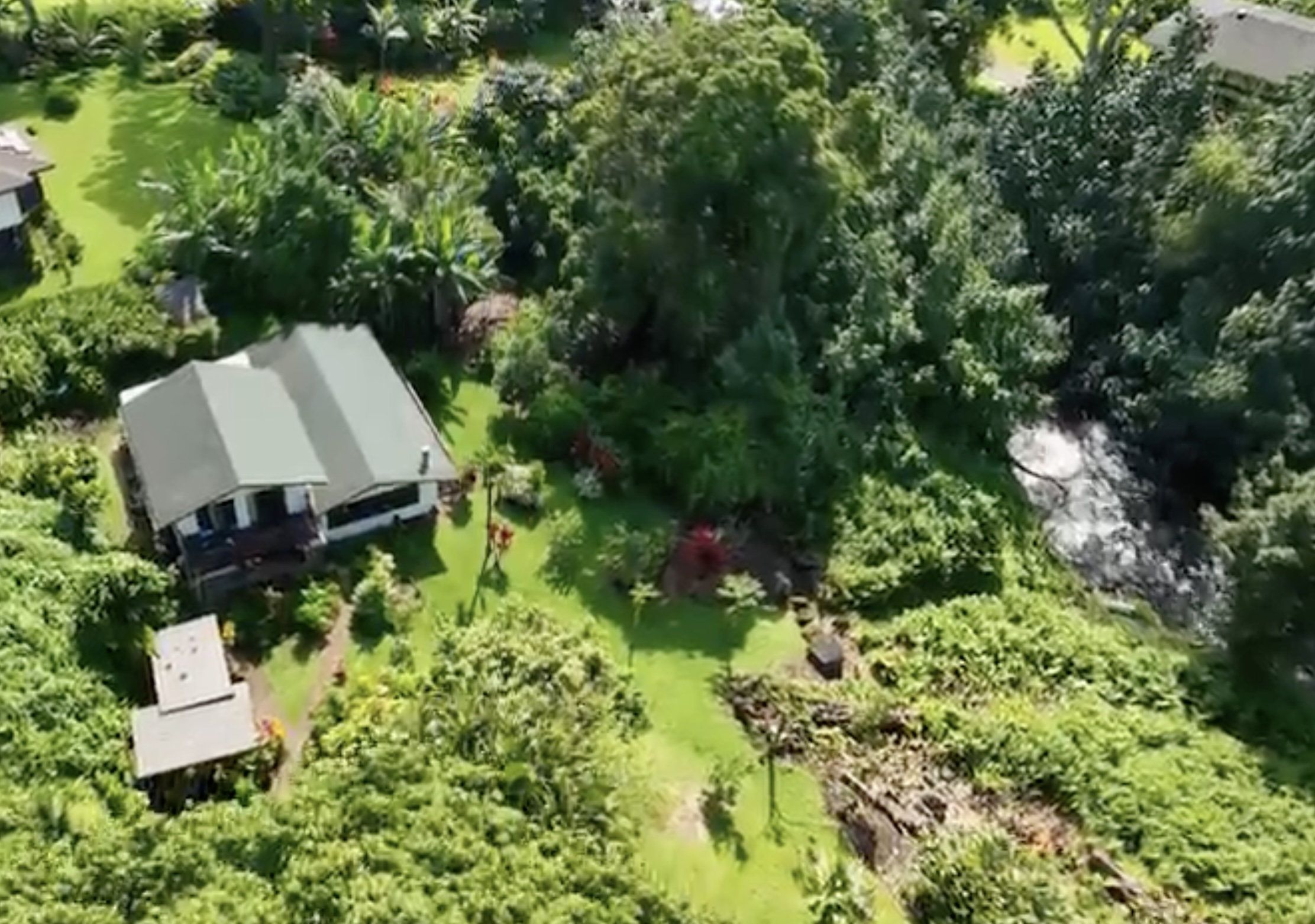 4867 Wainiha Powerhouse Road Hanalei, HI 96714 - Photo 26 of 26 an aerial view of a house with a yard and outdoor seating