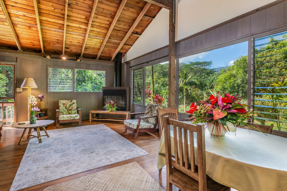 4867 Wainiha Powerhouse Road Hanalei, HI 96714 - Photo 5 of 26 a living room with furniture and a potted plant