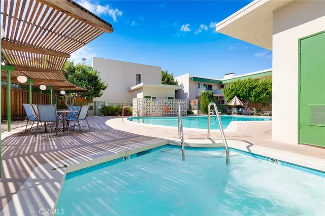 a view of a backyard with sitting area