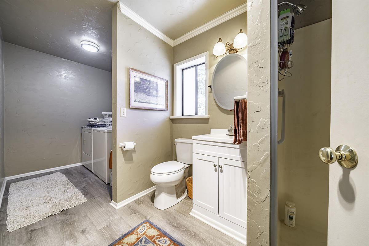 7785 Old Stage Road Central Point, OR 97502 - Photo 30 of 47 a bathroom with a toilet sink and mirror